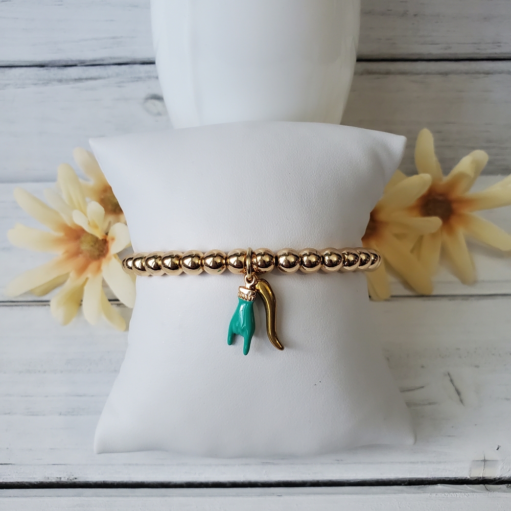 Elegant Gold Hematite Bracelet with Turquoise Mano Cornuto Charm